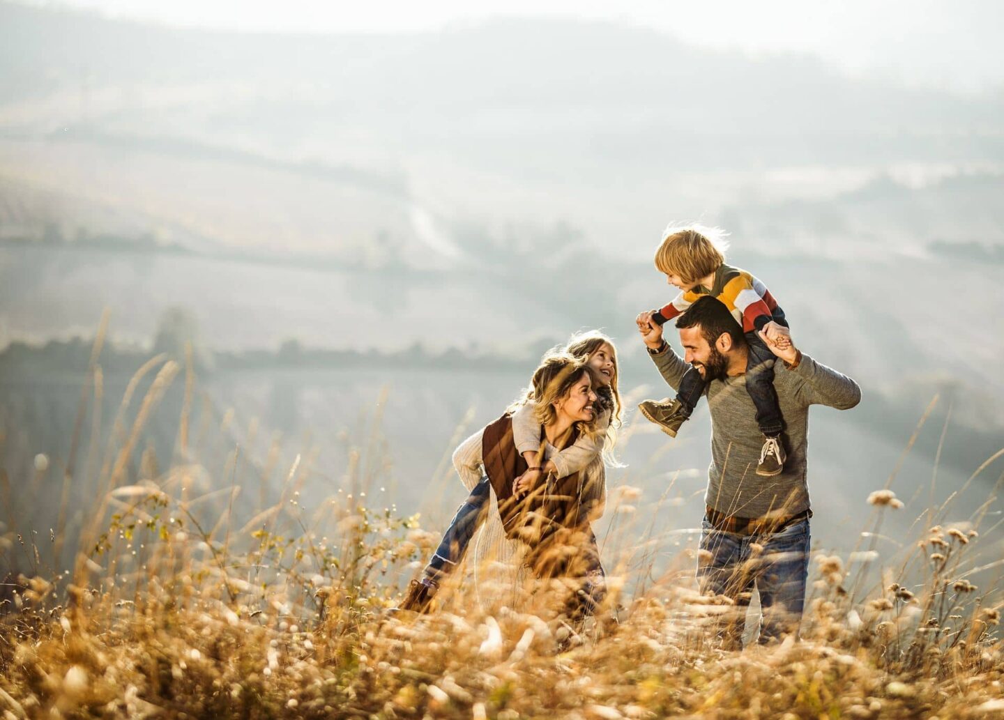 Family on hike in field